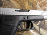 GLOCK
48,
THE JUST OUT GLOCK 48,
9-MM
LUGER FS 10-SHOT BLACK FRAME SILVER SLIDE,
2- MAGAZINES,
4"
BARREL,
FACTORY
NEW
IN
BOX. - 8 of 22