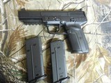 F.N.H.
5.7X28,
FN
FIVE-SEVEN,
BLACK,
ADJUCTABLE
SIGHTS,
3 - 20+1 ROUND
MAGAZINES,
Chrome - Lined
Chamber
&
Bore, FACTORY NEW IN BOX!!!!! - 4 of 24