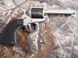 RUGER
# 2003
SILVER
CERAKOTE,
Wrangler
Revolver
Single,
22 LR,
4.62"
BARREL,
6 ROUND
Black
Synthetic
Grip,,
FIXED
SIGHTS NEW IN - 7 of 19