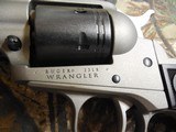 RUGER
# 2003
SILVER
CERAKOTE,
Wrangler
Revolver
Single,
22 LR,
4.62"
BARREL,
6 ROUND
Black
Synthetic
Grip,,
FIXED
SIGHTS NEW IN - 9 of 19