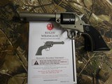 RUGER
# 2003
SILVER
CERAKOTE,
Wrangler
Revolver
Single,
22 LR,
4.62"
BARREL,
6 ROUND
Black
Synthetic
Grip,,
FIXED
SIGHTS NEW IN - 6 of 19