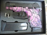 SCCY
9-MM
MUDDY
GIRL,
2 -10
ROUND
MAGAZINES,
COMBAT
SIGHTS,
MANUAL
SAFETY, - 2 of 18