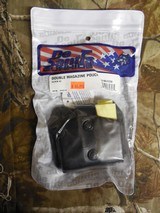 DESANTIS, DOUBLE MAGAZINE POUCH,
LEATHER,
GLOCK 42
BLACK,
HOLDS
TWO
SINGLE
MAGAZINES,
WORKS
ON
A LOT
OF
SINGLE
380
MAGS, - 1 of 14