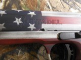 Citadel
M-1911,
with
Ammo
Can,
45
A.C.P. Single
Action,
5"
Barrel,
2 - 8+1
Round
Mags,
Black G10 Grip,
American Flag Cerakote Slid - 12 of 20