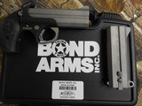 BOND-ARMS, WACKED, COMBO,
TWO
BARRELS,
9-MM
AND
45 L.C. / 410 SHOTGUN,
4.25"
BARRELLS,
S / S,
BLACK
RUBBER
GRIPS,
FACTORY
NEW
IN - 16 of 22