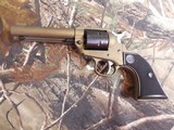 Ruger
2004
Wrangler
Revolver,
22 LR.
4.62" BARREL,
6
Round
Black
Checkered
Grip,
Burnt
Bronze
Cerakote, FACTORY
NEW
NI
BOX.. - 6 of 21