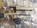 Ruger
2004
Wrangler
Revolver,
22 LR.
4.62" BARREL,
6
Round
Black
Checkered
Grip,
Burnt
Bronze
Cerakote, FACTORY
NEW
NI
BOX.. - 13 of 21