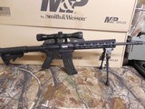 S&W M&P 15-22 SPORT,
.BUNDLE
GUN,
22-LR, 16.5"
BARREL,
25
ROUND
MAG.,
6-POSITION
STOCK,
M&P-0404 4x32 riflescope and a Caldwell XLA bip - 1 of 26