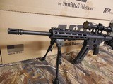 S&W M&P 15-22 SPORT,
.BUNDLE
GUN,
22-LR, 16.5"
BARREL,
25
ROUND
MAG.,
6-POSITION
STOCK,
M&P-0404 4x32 riflescope and a Caldwell XLA bip - 9 of 26