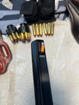 Ruger GP100 4 Inch with 4 holsters and 2 speedloaders - 9 of 10