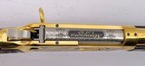 INVESTMENT ARMS WINCHESTER
94AE "A TRIBUTE TO OLD GLORY" 24K GOLD PLATED 1818-1960 MINNESOTA 1 OF 10 ENGRAVED WOOD W/ PRES CASE .45 COLT - 23 of 25