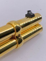 INVESTMENT ARMS WINCHESTER
94AE "A TRIBUTE TO OLD GLORY" 24K GOLD PLATED 1818-1960 MINNESOTA 1 OF 10 ENGRAVED WOOD W/ PRES CASE .45 COLT - 24 of 25