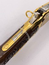 INVESTMENT ARMS WINCHESTER
94AE "A TRIBUTE TO OLD GLORY" 24K GOLD PLATED 1818-1960 MINNESOTA 1 OF 10 ENGRAVED WOOD W/ PRES CASE .45 COLT - 22 of 25