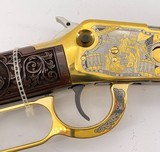 INVESTMENT ARMS WINCHESTER
94AE "A TRIBUTE TO OLD GLORY" 24K GOLD PLATED 1818-1960 MINNESOTA 1 OF 10 ENGRAVED WOOD W/ PRES CASE .45 COLT - 18 of 25