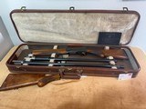 Youth set up - 1960 FN Belgian Browning Auto-5 Sweet 16 with multiple barrels, stocks, and case.