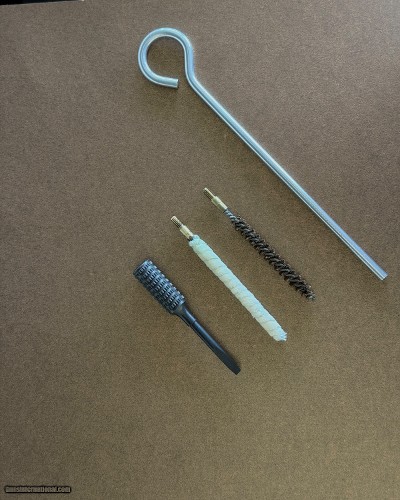 SMITH AND WESSON FACTORY ORIGINAL K-32 REVOLVER CLEANING KIT WITH KNURLED SIGHT TOOL
CIRCA 1940'S