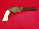 VOLCANIC REPEATING
NAVY
REVOLVER, IVORY GRIPS, ENGRAVED - 6 of 15
