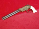 VOLCANIC REPEATING
NAVY
REVOLVER, IVORY GRIPS, ENGRAVED - 7 of 15