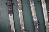 A recently discovered collection of Turn of the Century, Highly Engraved, Ornate Ivory Handled Ceremonial Swords. Some pre 1900, some Post 1900. - 5 of 6