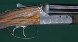 John Dickson & Sons --- Consecutive pair, Round Action Shotguns --- 12 Gauge, 2 3/4