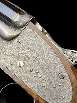 EXQUISITE -
HAUPTMANN
- DOUBLE RIFLE SIDELOCK DRILLING
-
OCTAGONAL BBLS
- EXHIBITION WOOD - 8x57 / 8x57 / 20ga-3