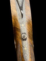 EXQUISITE -
HAUPTMANN
- DOUBLE RIFLE SIDELOCK DRILLING
-
OCTAGONAL BBLS
- EXHIBITION WOOD - 8x57 / 8x57 / 20ga-3