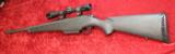 Mossberg 695 bolt action 12 gauge Slug gun w/Weaver Scope - 1 of 11