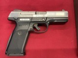 Ruger SR9 semi-auto 9mm black/stainless - 1 of 5