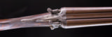 Holland & Holland
Top Lever hammer gun with beautiful Damascus barrels - 5 of 8