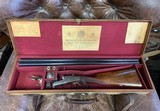 Holland and Holland 2" double with 28" barrels!How rare is that and in nice condition and in its makers case - 11 of 12