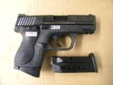 Smith & Wesson M&P9c Compact 9mm Para. w/Crimson Trace Laser Grips - 1 of 5