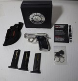 Taurus PT-2222 caliber semi auto pistol w/original case, manual,3 clips, ammo, and holster - Image 1 of 12