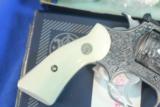 Smith & Wesson Model 63 .22lr Stainless Steel, deep fully engraved with genuine Ivory grips, boxed
- 8 of 12
