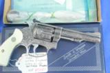 Smith & Wesson Model 63 .22lr Stainless Steel, deep fully engraved with genuine Ivory grips, boxed
- 4 of 12