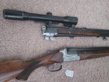 MERKEL Model 200E O/U Shotgun 16/70ga with an O/U Rifle 7x65R– Shot 16/70 Exchange Barrel
and Hensoldt 1.5-6x42 Scope
on quick release claw mounts - 6 of 15