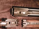 Cogswell and Harrison 16 ga. side-plated, self-opening BLE with very straight stock dimensions.
- 9 of 10