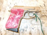 TAURUS PT-22 22CAL SNK W/ PINK GRIPS - 1 of 2