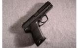 Heckler and Koch, Model USP 40 Semi-Auto, .40 Smith and Wesson - 1 of 2