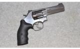 Smith and Wesson, Model 617-6 K-22 Masterpiece Stainless Double Action Revolver, .22 Long Rifle - 1 of 2