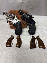 TWO Smith & Wesson Model 36 revolvers no dash one blue 7 one nickel W/ Two sets grips