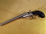 Double barreled pistol in 380 black powder cartridge, fired with firing pins like a hammered shotgun - 1 of 5