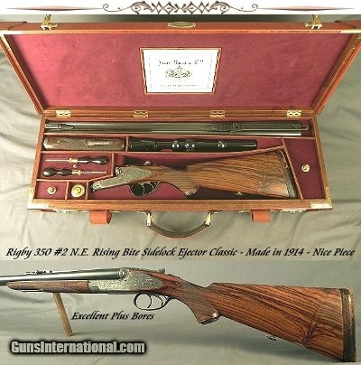 RIGBY RISING BITE 350 #2 N. E.- VERY NICE 1914 SIDELOCK CLASSIC- 26" EJECT CHOPPER LUMP Bbls.- EXC. PLUS BORES- DELUXE HUEY O & L TRUNK CASE