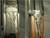 RIGBY 470 N. E. LONDON SIDELOCK EJECTOR- LONDON PROOF 1998- 90% COVERAGE of FLORAL & 3 AFRICAN GAME ANIMALS- EXC. WOOD- OVERALL REMAINS at 98%- CASED - 5 of 8