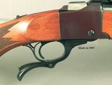 RUGER #1-B in 22-250 REM.- APPEARS UNFIRED- OVERALL in 99.5% ORIG. COND.- 26" MEDIUM WEIGHT Bbl.- NO OPEN SIGHTS- MOUNTED w/ TASCO 6 x 24 SCOPE - 2 of 4