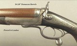 MANTON & Co. 10 BORE EXPRESS- EXC. PLUS FULL RIFLED BORES THAT ARE 9 - 9.5%- 26 1/4" DAMASCUS Bbls.- PROVED in LONDON- 10 Lbs. 4 Oz.- 2 7/8" - 2 of 7