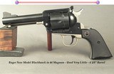 RUGER NEW MODEL BLACKHAWK- 44 MAG.- 4 5/8" Bbl.- ADJUSTABLE REAR SIGHT- VERY LITTLE USED- BLUE REMAINS at 99%- MADE 2006- ALLOY GRIP FRAME - 1 of 2