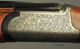 B. RIZZINI 20 BORE- O/U MODEL ROUND BODY DELUXE- SATIN FINISH RECEIVER- VERY NICE WOOD- SINGLE SELECTIVE TRIGGER- 6 SCREW CHOKES- ENGLISH STOCK - 2 of 5
