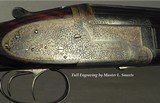BELGIUM 12 O/U SIDELOCK EJECT- 1937- SOLD by PIRLET ARMURIERS in PARIS- 29 1/4" SOLID RIB BBLS.- NEAR EXHIBITION WOOD- 97% L. SMEETS ENGRAVED- 6/ - 2 of 7