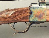 DAKOTA 300 WIN. MAG. FACTORY DELUXE MODEL 10 S S- EXC ENGLISH WALNUT- REMAINS as NEW- CASE COLORED ACTION- LEUPOLD 4.5 x 14- CASE COLORED - 2 of 5
