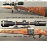 DAKOTA 300 WIN. MAG. FACTORY DELUXE MODEL 10 S S- EXC ENGLISH WALNUT- REMAINS as NEW- CASE COLORED ACTION- LEUPOLD 4.5 x 14- CASE COLORED - 1 of 5